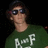 A pixelated image of a person in sunglasses and green shirt on left, with red background text reading 'Connor, I miss you so much <33' and dates below.