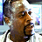 A pixelated contact sheet showing two frames of an animated icon featuring a man's face on the left and green text reading "Original Icons .com" on the right against a dark background.