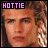 Three pixelated headshots of a young man with light brown hair appear above two white containing pink and black text