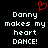Black background with white pixelated text reading 'Danny makes my heart DANCE!' and a red pixelated heart symbol above the left side of the text.