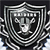 Pixelated grayscale icon with a central face-like shape surrounded by layered geometric borders and radiating lines.