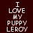 Pixelated text "I LOVE MY PUPPY LEROY" arranged in a with cyan highlight bars shifting across on a dark brown background