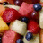 Pixelated fruit salad image with green text on yellow background, labeled 'Casey' and 'Fruit Salad Yummy!!! Yummy!!!'