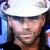 A person wearing a white cap and dark clothing appears in three showing slight head movement