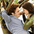 Two people embrace in a close-up, with overlaid text reading "you're like my own" and "person a brand of heroin" in pixelated font.