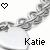 Pixelated icon with a black heart symbol in the top-left corner, a grayscale abstract shape in the center, and the name 'Katie' in bold black text at the bottom.