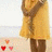 Animated icon of a figure in yellow coat and brown scarf with heart symbols shifting positions.