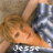 A static image shows a person with light brown hair lying down, wearing blue and white striped clothing, next to a red heart symbol with the word 'love' in pixelated text.