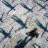 A static pixelated image with a mosaic of pastel and dark colors forming abstract shapes against a light gray background.