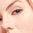 A pixelated collage of a woman's face with red text reading 'the girl next door' on white background.