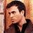 Pixelated static image of a person with dark hair and light skin wearing a black top against an orange-brown background.
