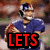 A football player in a blue uniform holding a brown football, with text overlays changing from 'LETS' to 'GO' and then 'GIANTS'.