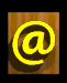 Animated contact sheet showing 9 frames of a yellow @ symbol and "EMAIL ME" text on wooden backgrounds with varying angles, shadows, and perspective effects.