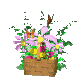 A wooden crate filled with pink and yellow flowers, green foliage, and multiple butterflies in various positions