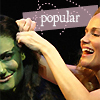 Two people interact closely; one person's hand touches the other's head under a purple banner reading 'popular' with scattered white dots.