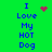 Green background with blue text reading "I Love My HOT Dog" and a red heart symbol that changes to a red starburst pattern.