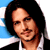 Animated contact sheet showing two frames of a pixelated celebrity image with text on the right side against a blue background.