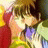 Anime-style character with brown hair and closed eyes, wearing a yellow and green outfit with purple accents, positioned next to black background with white text.