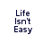 Four identical pixelated text blocks reading "Life Isn't Easy" arranged in a on white background