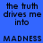 Blue background with black text reading 'the truth drives me into MADNESS' in pixelated font, alternating pink and blue horizontal bars across the image.