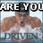Pixelated image of a person with muscular arms wearing sunglasses and a white shirt, overlaid with bold text reading "ARE YOU" at top and "DROPPIN'" at bottom.