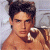 A pixelated image of a shirtless person with dark hair lying on a light-colored surface, next to green text reading 'Original Icons .com' in bright green letters.