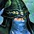 Pixelated static image of a figure with dark hair and blue clothing against a greenish background, showing partial facial features.