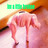 Pixelated image of a figure in pink attire with green text above, set against warm-toned background.