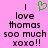 Pixelated text on pink background with green heart symbol above 'love thomas sooo much xoxo!!' in black block letters.