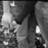 Black-and-white animated sequence showing a person in striped clothing holding another figure, with visible motion between frames.