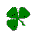 Nine pixelated green clover icons arranged in a on a gray background, each with distinct leaf arrangements and stem positions