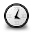Circular clock icon with black border, white face, and black hour/minute hands showing approximately 1:05, rendered in pixelated style with gray background.