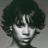 A 48x48 pixel buddy icon split into two sections: a grayscale portrait of a person with curly hair on the left and green text reading "Original Icons .com" on a dark green background on the right.