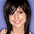 A pixelated image split into two sections: a person with dark hair on the left and yellow text on a red background on the right.