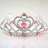 A pixelated crown with pink gemstones on a light background, accompanied by pink text reading 'The Princess is here!' on a solid pink backdrop.