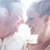 Two pixelated faces in profile view facing each other with mouths open, set against a light blue and white background.