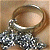 A 50x50 pixel animated buddy icon featuring a metallic ring and chain on the left, with green text "Original Icons .com" on a dark green background to the right.