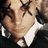 Pixelated image of a person with closed eyes and a white collar, next to pixelated text reading "FRANK IERO IS MY HERO" on a black background.