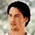 Pixelated static image of a person's head and shoulders with dark hair against a blurred background, appearing as an AIM buddy icon.