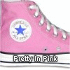 Pink high-top sneaker with white laces and a blue star logo on a circular patch, displayed in a with repeated text "Pretty In Pink" below