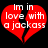 Red broken heart shape with white text reading "Im in love with a jackass" on black background.