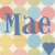 Pixelated image with pastel-colored circular shapes and a blue heart, featuring the word 'Mae' in stylized dark blue letters.