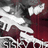 Pixelated static image showing abstract white and dark red shapes against a gray background with no discernible text or recognizable subjects.