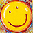 Static 48x48 pixel buddy icon featuring a yellow smiley face with red outline and two small dark eyes, set against a colorful pixelated background.