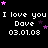 Pixelated text displays 'I love you Dave 03.01.08' repeated across a black background with scattered pink and purple stars.