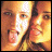 pixelated text with a small photo of two people in the top-left corner, displaying sequential text changes