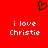 Red background with white text reading "i love Christie" and a green pixelated heart symbol above the text.