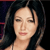 Pixelated close-up of a person with dark hair, closed eyes, and light skin against a dark background with faint red and blue elements.