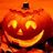 A pixelated pumpkin face with glowing eyes and mouth against an orange background, next to 'happy halloween' text on red.