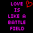Pixelated text reads 'LOVE IS LIKE A BATTLE FIELD' in bright pink on black background with red heart symbol above 'LOVE'.